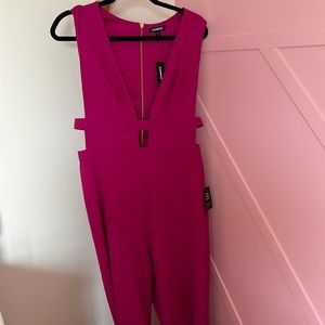 Magenta wide leg one piece pant outfit side cut outs and deep v neck opening